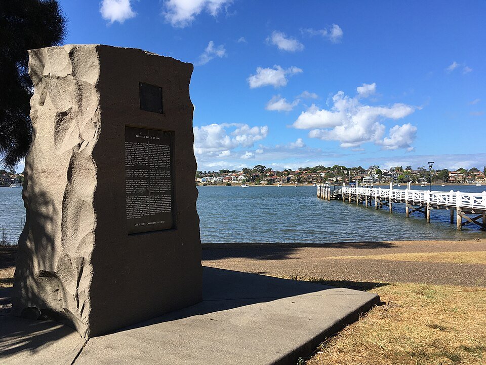 The memorial stone and ferry wharf at Bayview Park