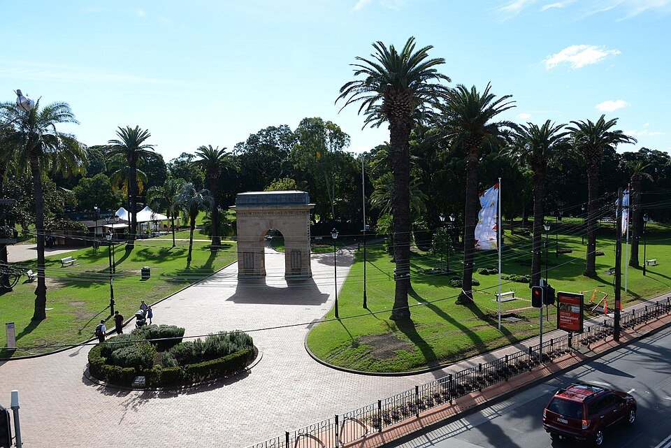 Palm-lined paths and the memorial arch in Burwood Park